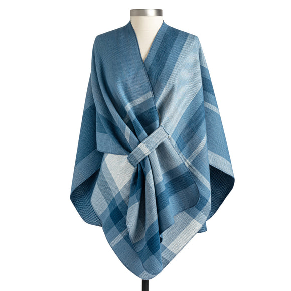 This beautiful wrap will be a staple in your closet this year! It can hang loosely, but we love the option of tucking in one front end into the loop attached to this wrap that does double duty because it reverses to a smaller indigo plaid on the other side - woohoo! Two wraps in ONE to stretch out your wardrobe, giving so many options!  100% Polyester  One size fits most. Laid flat measurements are approximately  44