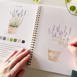 Watercolor workbooks are just like a coloring book, but with watercolor! Enjoy this peaceful hobby on your own, with kids, and with friends. Makes a wonderful gift. Perfect for artists of any age. This Garden Watercolor book has beautiful illustrations of plants, cottages, watering cans &amp; more!

12 beginner-friendly, lightly sketched illustrations

Simple step-by-step instructions and example

Lay flat spiral pages for easy painting

Durable 120 lb watercolor paper

Travel ready 6.5 inch x 9 inch size