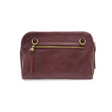 Retro styling crafted in antiqued vegan leather gives this beauitful currant colored clutch a vintage vibe. The removable woven wrist strap is the finishing touch on this stylish bag, so you can wear as a wristlet, a clutch, or even a crossbody with the included removable shoulder strap!





6.75"H x 9.75"W x 2.25"D

Removable and adjustable crossbody strap 22"-26"

Removable long wristlet strap 7.5" long

Zippered top closure

Interior zippered pocket

Exterior back zipper pocket

Brass plated hardware

1