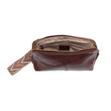 Retro styling crafted in antiqued vegan leather gives this beauitful currant colored clutch a vintage vibe. The removable woven wrist strap is the finishing touch on this stylish bag, so you can wear as a wristlet, a clutch, or even a crossbody with the included removable shoulder strap!





6.75"H x 9.75"W x 2.25"D

Removable and adjustable crossbody strap 22"-26"

Removable long wristlet strap 7.5" long

Zippered top closure

Interior zippered pocket

Exterior back zipper pocket

Brass plated hardware

1