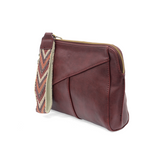 Retro styling crafted in antiqued vegan leather gives this beauitful currant colored clutch a vintage vibe. The removable woven wrist strap is the finishing touch on this stylish bag, so you can wear as a wristlet, a clutch, or even a crossbody with the included removable shoulder strap!





6.75"H x 9.75"W x 2.25"D

Removable and adjustable crossbody strap 22"-26"

Removable long wristlet strap 7.5" long

Zippered top closure

Interior zippered pocket

Exterior back zipper pocket

Brass plated hardware

1