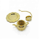 This golden stainless steel teapot-shaped tea infuser is perfect for loose-leaf tea lovers! Made from durable 304 food-grade stainless steel, it’s rust-proof and easy to clean, even dishwasher-safe. The set includes a drip tray and an adorable teapot-shaped infuser. IT makes an excellent gift for tea enthusiasts.

Approximate size: 2.4" dia. (drip tray) x 1.1"H