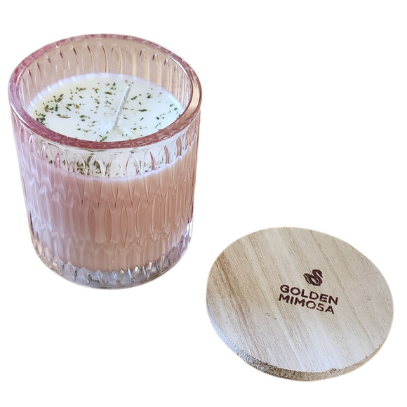 You'll love our newest cathedral glass tumbler! This hibiscus & cherry blossom candle has been poured into a pretty pink patterned glass and comes with a wooden lid.

Bold throws of orange, grapefruit and citrus blended with a hint of champagne will have you daydreaming about Sunday brunch all week!

Filled with 6.5 oz. of American Soybean WaxTM. Measures 3.25