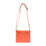 Your perfect goes with anything bag! In just the right size to carry your essentials, this beautiful grapefruit colored pebbled vegan leather bag has multiple pockets and a top zip closure for security, so you are ready for anything your day brings. Add one of our interchangeable Guitar Straps to add your own style!


Product Details
Dimensions: 11 in. W x 11.25 in. H x 3.5 in. D
Magnetic Snap Closure
2 Open and 1 Zipper Interior Pockets
2 Exterior Open Pockets and 1 Back Zipper Pocket
12x18 in. Drop Adjust