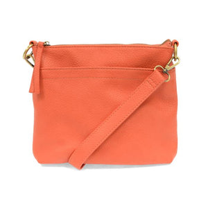 Your perfect goes with anything bag! In just the right size to carry your essentials, this beautiful grapefruit colored pebbled vegan leather bag has multiple pockets and a top zip closure for security, so you are ready for anything your day brings. Add one of our interchangeable Guitar Straps to add your own style!


Product Details
Dimensions: 11 in. W x 11.25 in. H x 3.5 in. D
Magnetic Snap Closure
2 Open and 1 Zipper Interior Pockets
2 Exterior Open Pockets and 1 Back Zipper Pocket
12x18 in. Drop Adjust