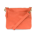 Your perfect goes with anything bag! In just the right size to carry your essentials, this beautiful grapefruit colored pebbled vegan leather bag has multiple pockets and a top zip closure for security, so you are ready for anything your day brings. Add one of our interchangeable Guitar Straps to add your own style!


Product Details
Dimensions: 11 in. W x 11.25 in. H x 3.5 in. D
Magnetic Snap Closure
2 Open and 1 Zipper Interior Pockets
2 Exterior Open Pockets and 1 Back Zipper Pocket
12x18 in. Drop Adjust