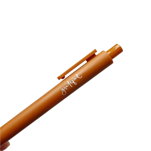 This pen from Emily Lex will make your writing better (for real! It's what everyone says when they try it!). Jotter pen in a dark camel color with 