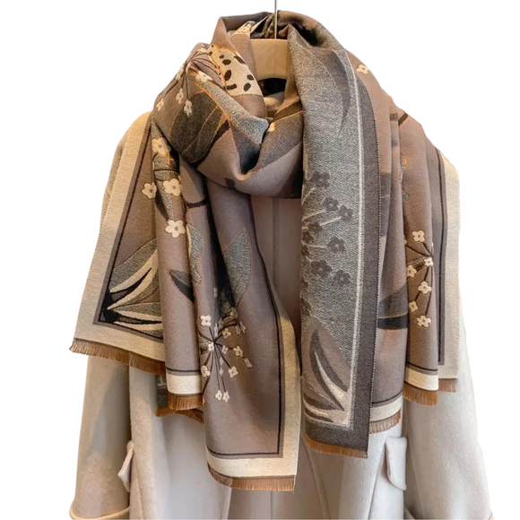 This one size fits all reversible wrap, drapes over and accents any outfit, casual or dressy. It feels and looks like cashmere. A beautiful layering piece!

55% Poly, 45% Viscose.

Dry clean or hand wash cold with light colors, lay flat to dry, iron on lowest setting if need, do not bleach.