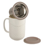 This 15oz Coral design tea infuser mug is made from new bone china and has a grey silicone top. The exterior of the tea infuser mug features a coral-textured design. The top part of the mug where you drink is a smooth finish. The mug's interior is white, allowing you to see the color of the tea. The mug includes a stainless steel filter for loose-leaf tea and tea bags. The mug has a comfortable handle and a nice weight and feel. It is not too heavy. The handle does not get hot in the microwave.
