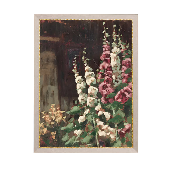 A beautiful view of white and pinkish-purple hollyhocks on premium canvas fabric for a lasting, textured finish! The taupe frame has a gold beaded trim along the inside that adds a classic charm.  Comes with a paper backing and hanging hardware for easy installation.

Made in the USA: Proudly crafted with quality and care. 

Care Instructions: Keep canvas dry to maintain its quality. If smudged or dirty, gently wipe with a dry, soft cloth.