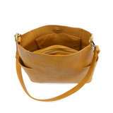 Casual and carefree crossbody in super soft pebble grain vegan leather! Our Kayleigh bucket bag is in a beautiful honey color and comes with a smaller bag that can be carried inside or used alone! The convenient side pockets of this bucket bag can hold your water bottle, phone, or glasses.&nbsp;     11" W X 11.25" H X 3.5"