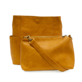 Casual and carefree crossbody in super soft pebble grain vegan leather! Our Kayleigh bucket bag is in a beautiful honey color and comes with a smaller bag that can be carried inside or used alone! The convenient side pockets of this bucket bag can hold your water bottle, phone, or glasses.&nbsp;     11" W X 11.25" H X 3.5"