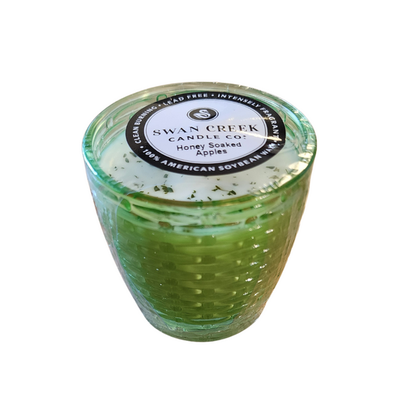 You'll love our cathedral small vase candle. This honey soaked apples candle has been poured into a pretty basketweave green glass.

Pure, Crisp and Refreshing. Mild honey notes with a pure crisp apple body for a high throw.

Filled with 4.5 oz. of American Soybean WaxTM. Measures 3