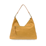 This oversized, slouchy, cool hobo bag is made of tumbled buffalo grain honeycomb colored vegan leather, which gives it that casual boho chic look! With two removable shoulder straps included, you can wear it as a short-shoulder bag or a crossbody bag.  Dimensions: 13.5 in. H x 16 in. W x 3.5 in. D