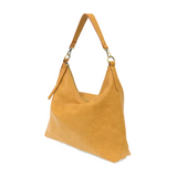 This oversized, slouchy, cool hobo bag is made of tumbled buffalo grain honeycomb colored vegan leather, which gives it that casual boho chic look! With two removable shoulder straps included, you can wear it as a short-shoulder bag or a crossbody bag.  Dimensions: 13.5 in. H x 16 in. W x 3.5 in. D