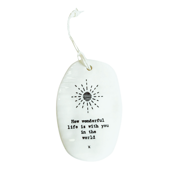 This oval-shaped porcelain ornament is perfect to give to someone to let them know you are thinking of them! A sun is shining on the ornament with the words: 