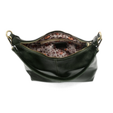The Danna crossbody is masterfully crafted in our gorgeous new tumbled gloss vegan forest green leather to give your look a polished yet casual vibe. Fitted with a top zip closure accented by our signature logo zip pull and two removable and interchangeable shoulder straps; a short shoulder strap to wear snug to the body or a long adjustable, removable crossbody shoulder strap to wear as a crossbody, this slouchy hobo design is perfect for your everyday style.


Dimensions: 9.5 in. H X 10.5 in. W X 3.5 in. 