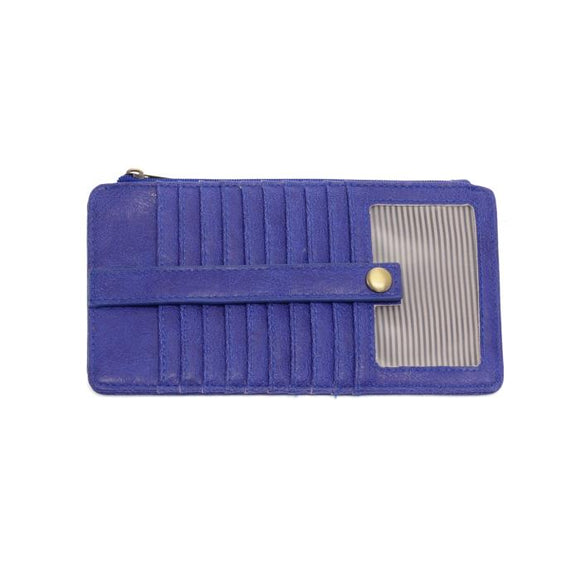 This slim and sleek wallet has nine credit card pockets, each with a snap tab for security and brass-plated hardware. It also has an ID window, zippered change pocket, and zippered billfold pocket in distressed beautiful cobalt vegan leather.


DIMENSIONS: 3.75 IN. H X 7.25 IN. W X .25 IN. D 


100% Vegan leather (polyurethane)