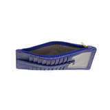 This slim and sleek wallet has nine credit card pockets, each with a snap tab for security and brass-plated hardware. It also has an ID window, zippered change pocket, and zippered billfold pocket in distressed beautiful cobalt vegan leather.


DIMENSIONS: 3.75 IN. H X 7.25 IN. W X .25 IN. D&nbsp;


100% Vegan leather (polyurethane)
