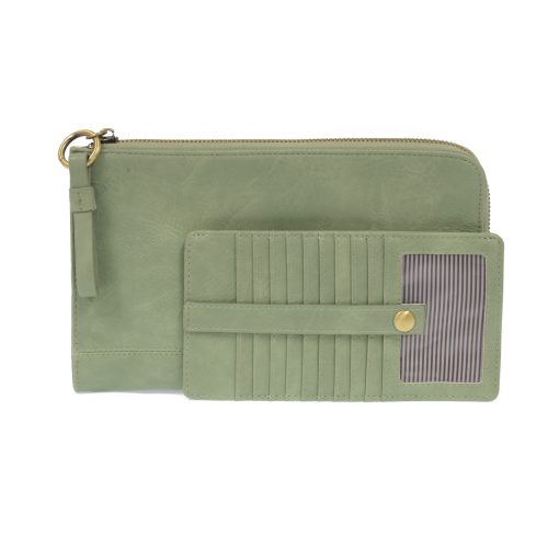 The Karina combines sleek styling with uber organization in beautiful antique-looking cameo green vegan leather! This bag has the ultimate versatility, as it can be worn as a crossbody, a clutch, or a wristlet. The bonus wallet, which includes credit card slots, ID windows, a zippered change pocket, and a billfold, will keep you organized and can be carried separately!


MAIN BAG: 9