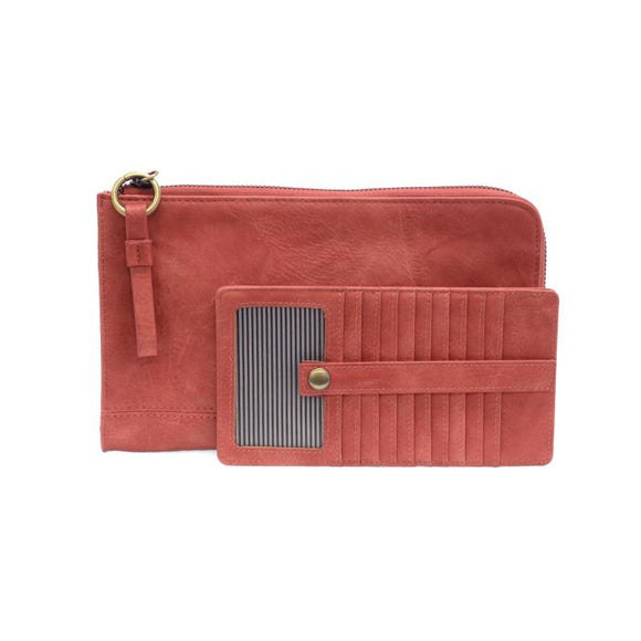 The Karina combines sleek styling with uber organization in beautiful antique-looking desert coral vegan leather! This bag has the ultimate versatility, as it can be worn as a crossbody, a clutch, or a wristlet. The bonus wallet, which includes credit card slots, ID windows, a zippered change pocket, and a billfold, will keep you organized and can be carried separately!


MAIN BAG: 9