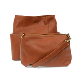 Brown leather handbag with a shoulder strap on a white background