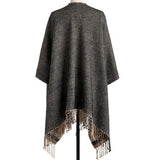 Whether snuggling up or going out, our soft acrylic Reversible Plaid Kimono is a closet must-have. Beautiful in Camel & Black, we love that it gives us two looks in one, but we also love the side buttons that make armholes and keep your kimono around your shoulders! Unbutton them to use as a big blanket scarf! So many possibilities!