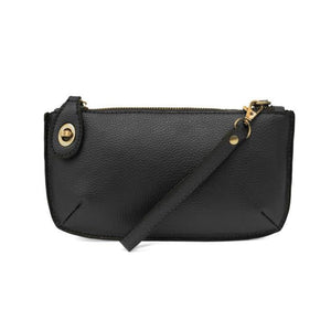 Our most popular bag, this mini clutch, with its sleek silhouette, is as gorgeous as it is versatile.  Features include polished turn lock, six card slots, and an interior zipper for change.  It can be styled in many ways, with removable straps for alternating between wallet, crossbody and wristlet!   5"H x 9.5"W x 1"D  Removable and adjustable crossbody strap 13"-24"  Wristlet strap 7" long  interior zippered pocket  brass plated hardware  100% vegan leather (polyurethane)
