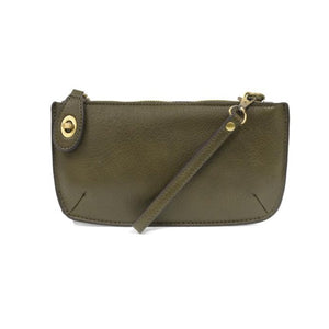 Our most popular bag, in a rich dark moss color, this mini clutch, with its sleek silhouette, is as gorgeous as it is versatile.  Features include a polished turn lock, six card slots, and an interior zipper for change.  It can be styled in many ways, with removable straps for alternating between wallet, crossbody, and wristlet!   5"H x 9.5"W x 1"D