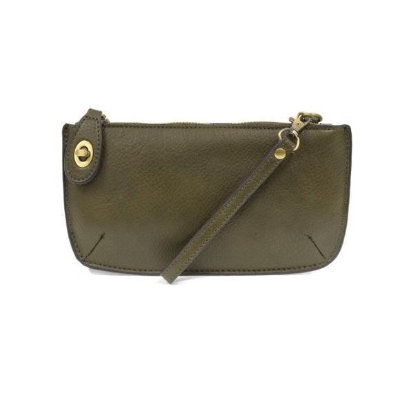 Our most popular bag, in a rich dark moss color, this mini clutch, with its sleek silhouette, is as gorgeous as it is versatile.  Features include a polished turn lock, six card slots, and an interior zipper for change.  It can be styled in many ways, with removable straps for alternating between wallet, crossbody, and wristlet!   5