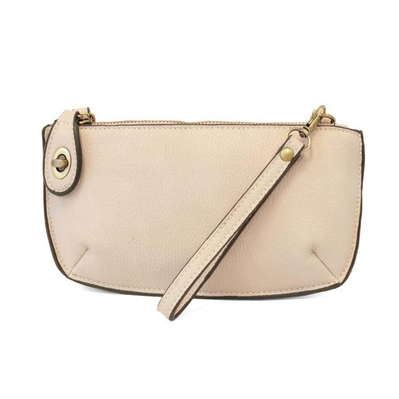 Our most popular bag, in a beautiful cream stone color, this mini clutch, with its sleek silhouette, is as gorgeous as it is versatile.  Features include a polished turn lock, six card slots, and an interior zipper for change.  It can be styled in many ways, with removable straps for alternating between wallet, crossbody, and wristlet!   5