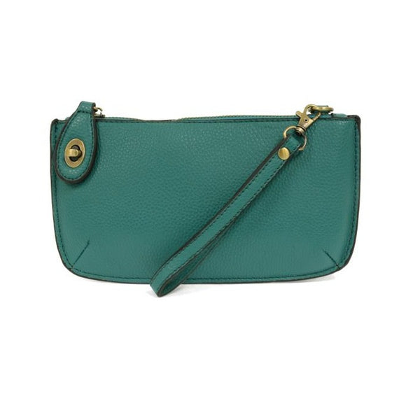 Our most popular bag, in a beautiful Gulf Steam Blue color, this mini clutch, with its sleek silhouette, is as gorgeous as it is versatile.  Features include a polished turn lock, six card slots, and an interior zipper for change.  It can be styled in many ways, with removable straps for alternating between wallet, crossbody, and wristlet!   5