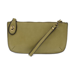 Our most popular bag, in a beautiful willow green color, this mini clutch, with its sleek silhouette, is as gorgeous as it is versatile.  Features include a polished turn lock, six card slots, and an interior zipper for change.  It can be styled in many ways, with removable straps for alternating between wallet, crossbody, and wristlet!   5"H x 9.5"W x 1"D