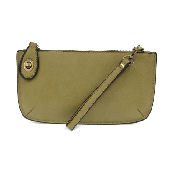 Our most popular bag, in a beautiful willow green color, this mini clutch, with its sleek silhouette, is as gorgeous as it is versatile.  Features include a polished turn lock, six card slots, and an interior zipper for change.  It can be styled in many ways, with removable straps for alternating between wallet, crossbody, and wristlet!   5