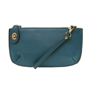 Our most popular bag, in a rich peacock blue color, this mini clutch, with its sleek silhouette, is as gorgeous as it is versatile.  Features include a polished turn lock, six card slots, and an interior zipper for change.  It can be styled in many ways, with removable straps for alternating between wallet, crossbody, and wristlet!   5"H x 9.5"W x 1"D