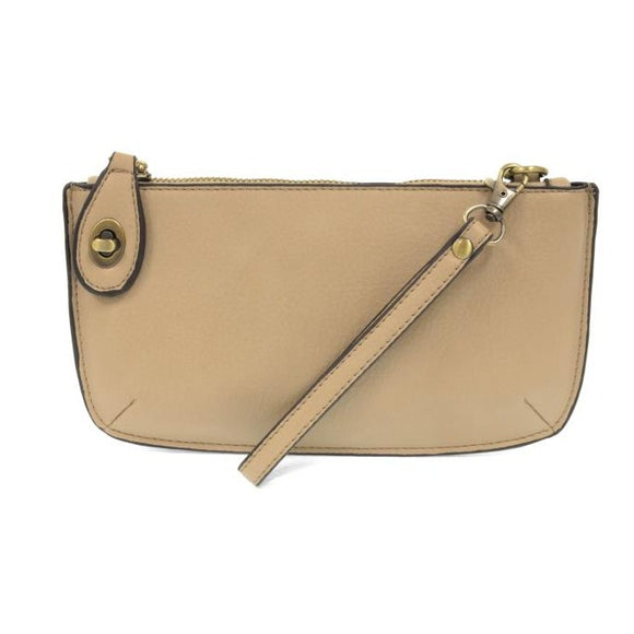 Our most popular bag, in a beautiful beach wood color, this mini clutch, with its sleek silhouette, is as gorgeous as it is versatile.  Features include a polished turn lock, six card slots, and an interior zipper for change.  It can be styled in many ways, with removable straps for alternating between wallet, crossbody, and wristlet!   5