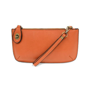 Our most popular bag, in a beautiful mango color, this mini clutch, with its sleek silhouette, is as gorgeous as it is versatile.&nbsp; Features include a polished turn lock, six card slots, and an interior zipper for change.&nbsp; It can be styled in many ways, with removable straps for alternating between wallet, crossbody, and wristlet!  &nbsp;5"H x 9.5"W x 1"D