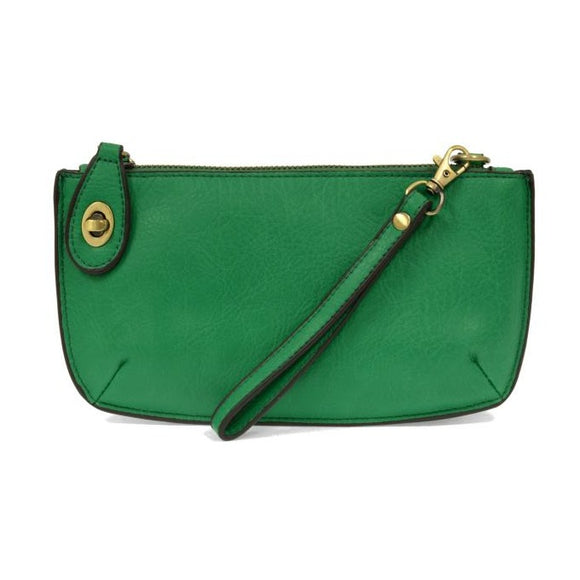 Our most popular bag in beautiful bright clover green! With its sleek silhouette, this mini clutch is as gorgeous as it is versatile.  Features include a polished turn lock, six card slots, and an interior zipper for change.  It can be styled in many ways, with removable straps for alternating between wallet, crossbody, and wristlet!   5
