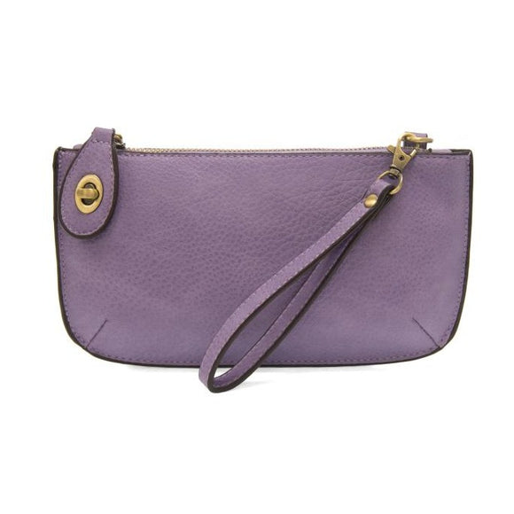 Our most popular bag, in a vibrant wild orchid color! With its sleek silhouette, this mini clutch is as gorgeous as it is versatile.  Features include a polished turn lock, six card slots, and an interior zipper for change.  It can be styled in many ways, with removable straps for alternating between wallet, crossbody, and wristlet!   5