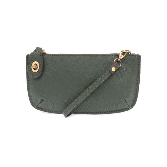 Our most popular bag in a rich chive color! With its sleek silhouette, this mini clutch is as gorgeous as it is versatile.  Features include a polished turn lock, six card slots, and an interior zipper for change.  It can be styled in many ways, with removable straps for alternating between wallet, crossbody, and wristlet!   5