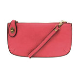 Our most popular bag, in a vibrant wild orchid color! With its sleek silhouette, this mini clutch is as gorgeous as it is versatile.  Features include a polished turn lock, six card slots, and an interior zipper for change.  It can be styled in many ways, with removable straps for alternating between wallet, crossbody, and wristlet!   5"H x 9.5"W x 1"D  Removable and adjustable crossbody strap 13"-24"  Wristlet strap 7" long