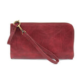 The Karina combines sleek styling with uber organization in beautiful antique-looking magenta-colored vegan leather! The ultimate versatility, this bag can be worn as a crossbody, as a clutch, or as a wristlet.  The included bonus wallet with credit card slots, ID windows, zippered change pocket, and billfold will keep you organized on the go and can be carried separately! MAIN BAG: 9"H x 6"W x 1"D Removable and adjustable crossbody strap 21"-26" with lobster claw clasps