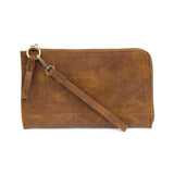 The Karina combines sleek styling with uber organization in beautiful antique-looking pecan-colored vegan leather! The ultimate versatility, this bag can be worn as a crossbody, as a clutch, or as a wristlet.  The included bonus wallet with credit card slots, ID windows, zippered change pocket, and billfold will keep you organized on the go and can be carried separately!