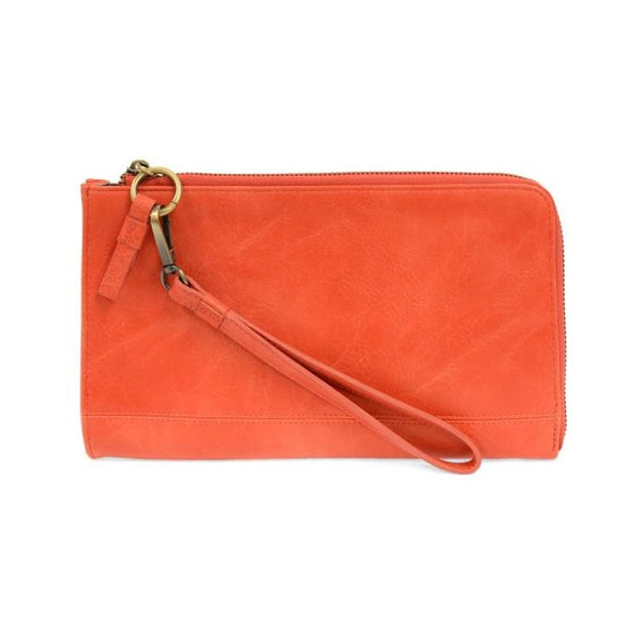 The Karina combines sleek styling with uber organization in beautiful antique-looking coral vegan leather! The ultimate versatility, this bag can be worn as a crossbody, as a clutch or as a wristlet.  The included bonus wallet with credit card slots, ID windows, zippered change pocket, and billfold will keep you organized on the go and can be carried separately!