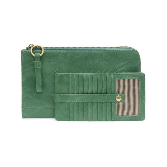 The Karina combines sleek styling with uber organization in vibrant antique-looking sea green vegan leather! The ultimate versatility, this bag can be worn as a crossbody, as a clutch or as a wristlet.  The included bonus wallet with credit card slots, ID windows, zippered change pocket, and billfold will keep you organized on the go and can be carried separately!