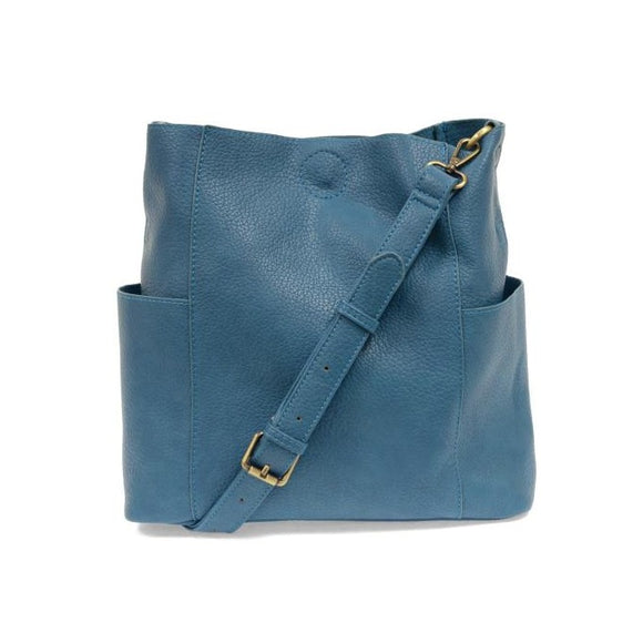 Casual and carefree crossbody in super soft pebble grain vegan leather! Our Kayleigh bucket bag in a beautiful peacock blue color comes with a smaller bag in the same color that can be carried inside or used alone! The convenient side pockets of this bucket bag can carry your water bottle, phone, or glasses.  11