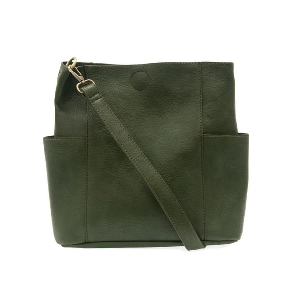 A casual and carefree crossbody in super soft pebble grain vegan leather, our Kayleigh bucket bag in a beautiful hunter green comes with a smaller bag that can be carried inside or used alone. The convenient side pockets of this bucket bag can hold your water bottle, phone, or glasses. 