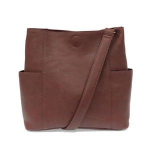 Casual and carefree crossbody in super soft pebble grain vegan leather! Our Kayleigh bucket bag in a beautiful plum color comes with a smaller bag that can be carried inside or used alone! The convenient side pockets of this bucket bag can carry your water bottle, phone, or glasses.  11" W X 11.25" H X 3.5"