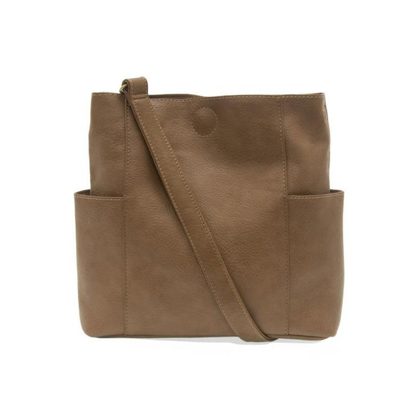 Casual and carefree crossbody in super soft pebble grain vegan leather! Our Kayleigh bucket bag in a beautiful fawn, tan color comes with a smaller bag that can be carried inside or used alone! The convenient side pockets of this bucket bag can carry your water bottle, phone, or glasses.  11