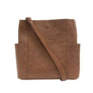 Casual and carefree crossbody in super soft pebble grain vegan leather! Our Kayleigh bucket bag in a beautiful walnut color comes with a smaller bag in the same color that can be carried inside or used alone! The convenient side pockets of this bucket bag can carry your water bottle, phone, or glasses.  11" W X 11.25" H X 3.5"